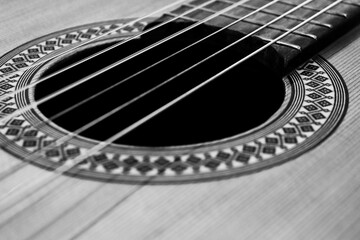 closeup classical guitar isolated on a black and white background