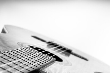 closeup classical guitar isolated on a black and white background