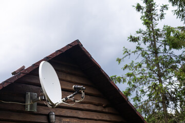 satelite is attached to the wall of the house