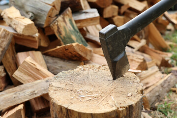 Axe and firewood. Renewable and sustainable energy concept
