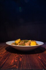 Meat stew on your plate on a wooden background. world food day concept.