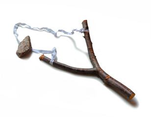 Slingshot and stones on a white background