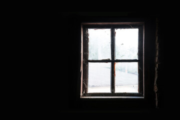 Fototapeta na wymiar Old window in the attic