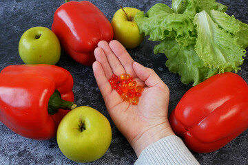 fresh natural fruits vs pills. Natural vitamin in fruits vs synthetic vitamin in pills. Choice between natural and synthetic way of health care. Alternative medicine. Dietary supplement