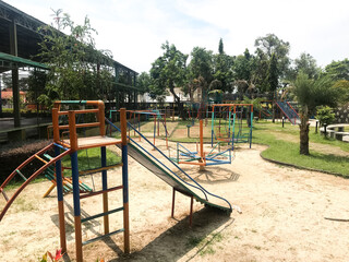 The play park for children is wrapped in red barrier tape. Outside. Prohibition of outdoor walks.