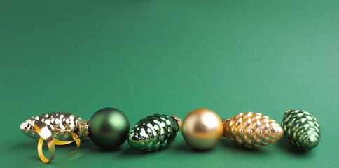 Vintage Christmas baubles on a green background with space for your text or image