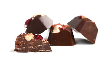 Cut luxury handmade bonbon with berry and nuts filling isolated on white background. Exclusive handcrafted candies