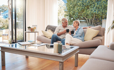 Relax, retirement and coffee with elderly couple bonding on a sofa, enjoying a peaceful morning in...