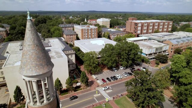 aerial past the moorehead patterson clock tower towards the unc chapel hill campus