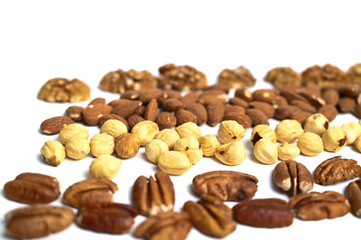 Different delicious nuts on white background, flat lay. Space for text. Nuts background