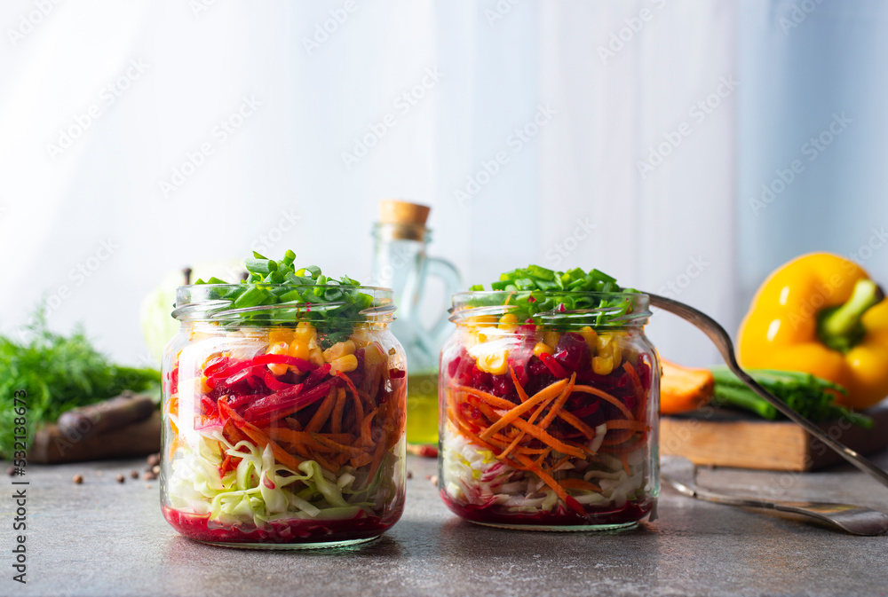 Canvas Prints fresh salad of autumn vegetables - purple and green cabbage, carrots, green onions. salad in bank