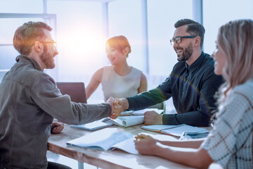 handshake business people at a meeting in the office © ASDF