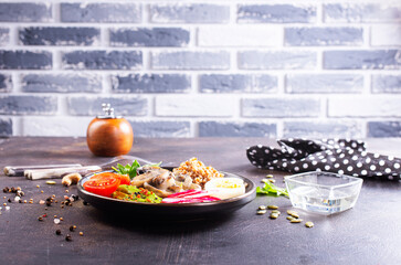 Cooked Buckwheat with avocado and mushrooms served in a bawl for breakfast. Gluten free meal.