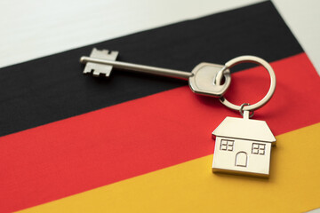 House with the flag of Germany. Immigration. Buying real estate. Houses for rent. Property price....
