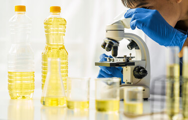 Cooking oil lab test , Quality control of vegetable oil industry products concept.
