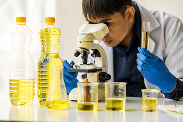 Cooking oil lab test , Quality control of vegetable oil industry products concept.