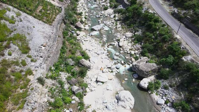 Drone Shot of a small road and river in Himachal Pradesh near Manali, Kasol