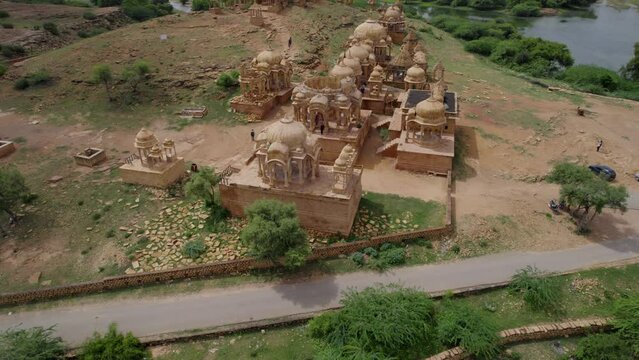 Aerial Flying Over Bada Bagh Temple In Jaisalmer Beside Lake. Dolly Forward