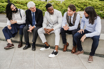 Multiethnic business men having fun outside of the office - Focus on african man face