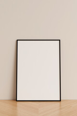 Clean and minimalist front view vertical black photo or poster frame mockup leaning against wall on wooden floor. 3d rendering.