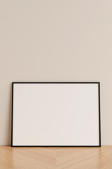 Clean and minimalist front view horizontal black photo or poster frame mockup leaning against wall on wooden floor. 3d rendering.