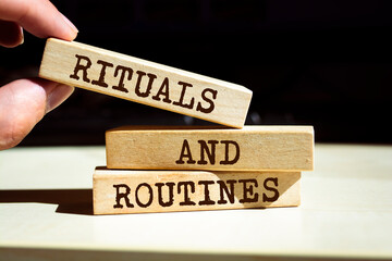 Wooden blocks with words 'Rituals and Routines'.
