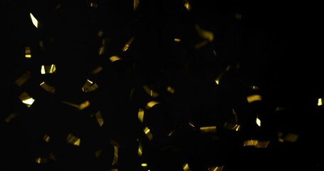 Falling foil confetti with gold glitter on a black background.