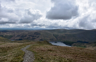 Thick Clouds Over Haweswater Resevoir Surrounded by Hills
