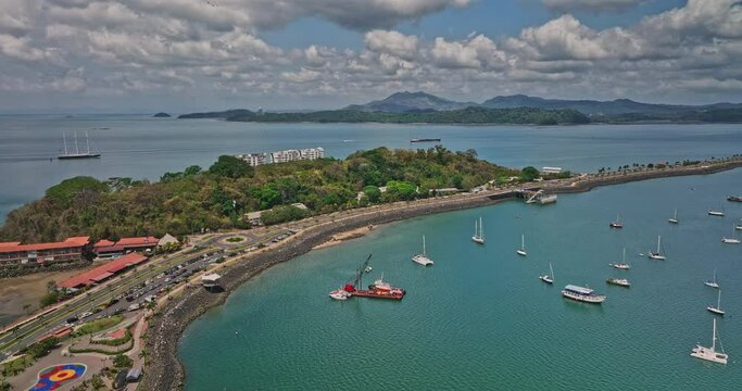 Panama City Aerial v95 panoramic panning view capturing beautiful naos island with avenue leading to amador with urban cityscape in the skyline - Shot with Mavic 3 Cine - April 2022