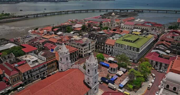 Panama City Aerial v103 birds eye view flyover and around independence square at historic district, tilt up reveals cinta costera 3 coastal beltway and bay view - Shot with Mavic 3 Cine - April 2022