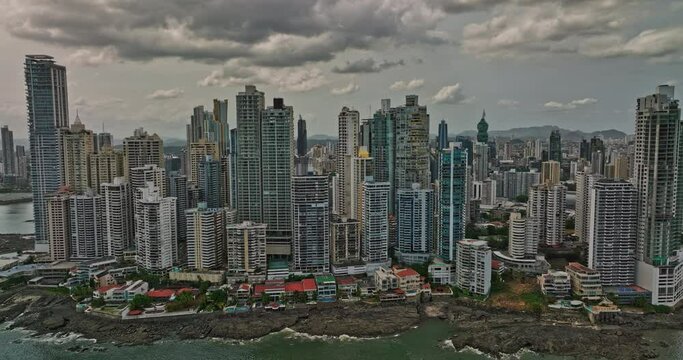 Panama City Aerial v7 fly around waterfront punta paitilla and pacifica neighborhoods capturing downtown cityscape with densely populated high-rise towers - Shot with Mavic 3 Cine - March 2022