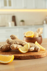 Fresh lemon and ginger on wooden table indoors, space for text