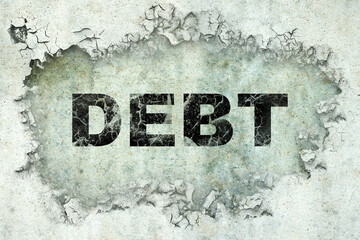 Debt word on cracked concrete. Business. Finance.