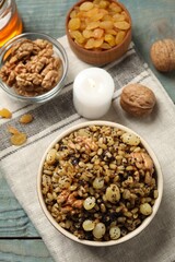 Traditional Christmas slavic dish kutia on light blue wooden table, above view