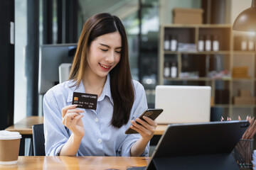Woman hand holding credit card  and using tablet for online shopping.Online shopping concept.