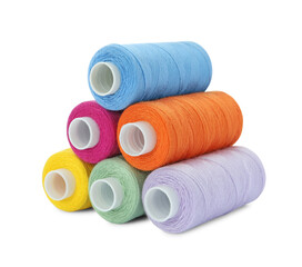 Different colorful sewing threads on white background