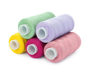 Different colorful sewing threads on white background