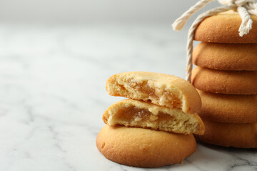 Tasty shortbread cookies on marble table, closeup. Space for text