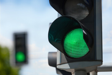 Traffic light on blurred background, closeup. Space for text