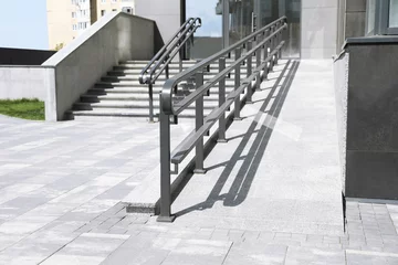 Fotobehang Outdoor stairs with ramp and metal railing © New Africa