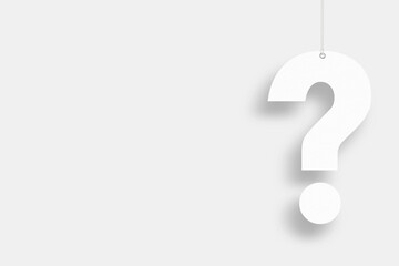 Question mark suspended by rope on white background