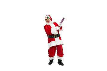 Portrait of senior man in image of Santa Claus posing in festive glasses and confetti flapper...