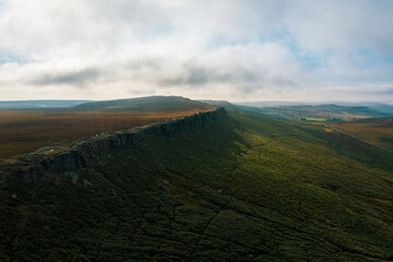 Stanage Edge in Peak District, England, UK. Derbyshire Magnificent landscape of rock formations and moorland at Stanage Edge in the Peak District in Derbyshire.  Aerial. Drone. 