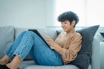 Woman shopping online via laptop computer,Using credit card for online shopping,Finance and debit,Lifestyle concept.