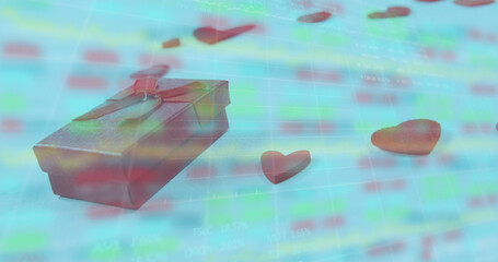 Image of gift box and heart shapes over moving graphs and trading board