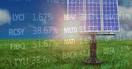 Image of financial data processing over solar panels in green field