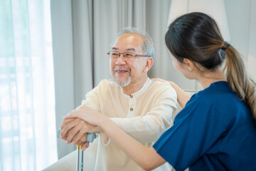 Obraz premium Caregiver talking to senior man in bedroom,Medical help trust support encourage reassure patient,Home care service.