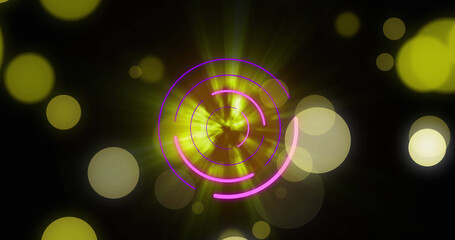 Images of moving yellow and pink glowing shapes over black background