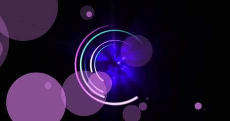 Images of moving blue and purple glowing shapes over black background
