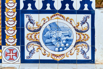 azulejo panels on a stone bench telling of maritime life in Olhao, Faro district Algarve, Portugal